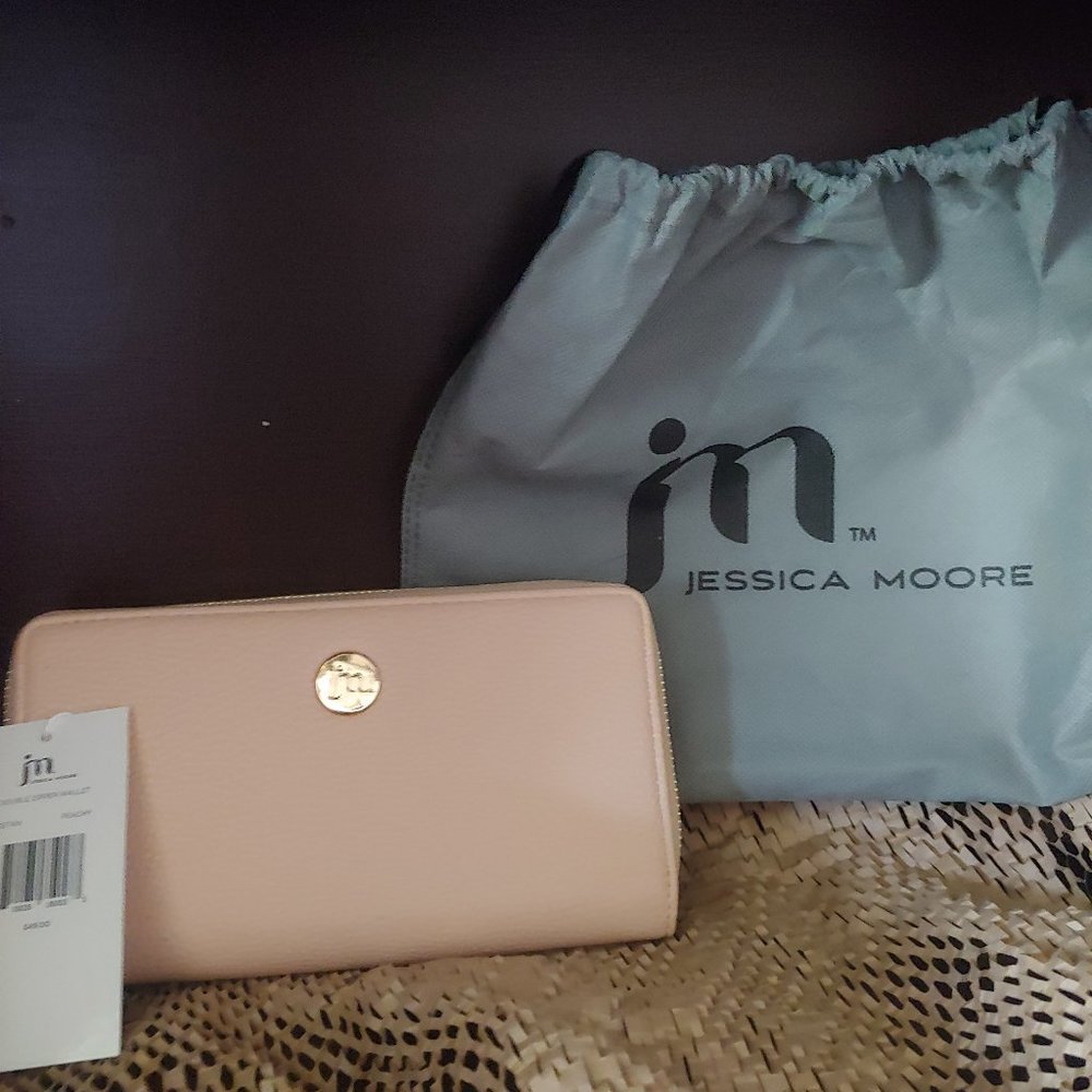 Jessica Moore Wallet, peachy tan color. Double zipper and wrist strap.